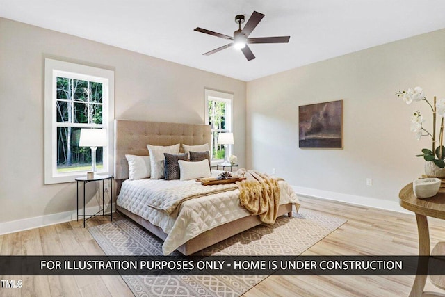 bedroom with wood finished floors and baseboards
