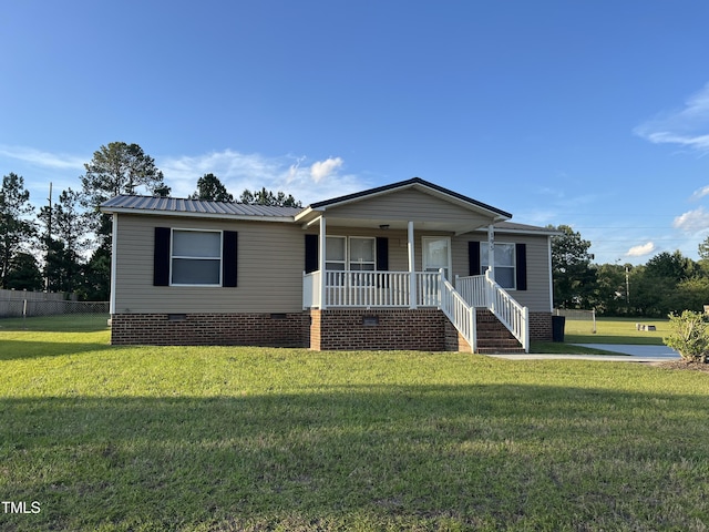 view of front of house with crawl space, covered porch, and metal roof