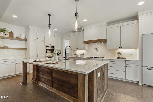1141 Duke Farm Dr, Wake Forest, NC 27587 - kitchen with stainless steel appliances, dark wood-style flooring, recessed lighting, a sink, and tasteful backsplash