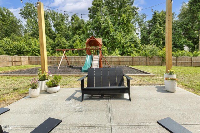 1141 Duke Farm Dr, Wake Forest, NC 27587 - view of patio / terrace with a playground and view of scattered trees