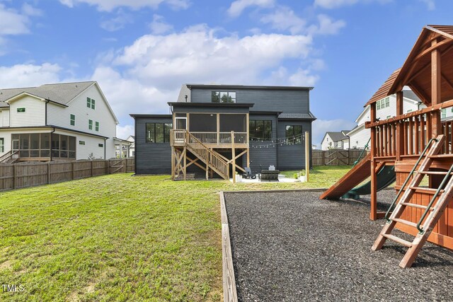 1141 Duke Farm Dr, Wake Forest, NC 27587 - back of house with a sunroom, a playground, and stairs