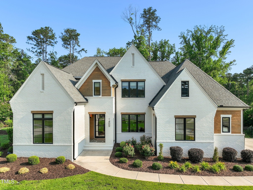 1409 Montvale Ridge Dr, Cary, NC 27519 - view of front of home featuring brick siding and roof with shingles