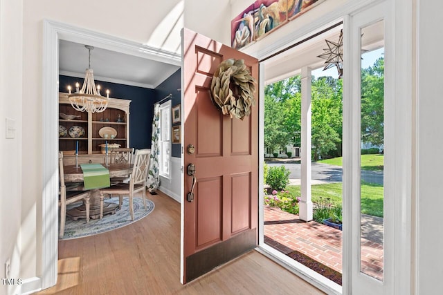 19 Knightsbridge Ct, Durham, NC 27707 - foyer with a chandelier, wood finished floors, and ornamental molding