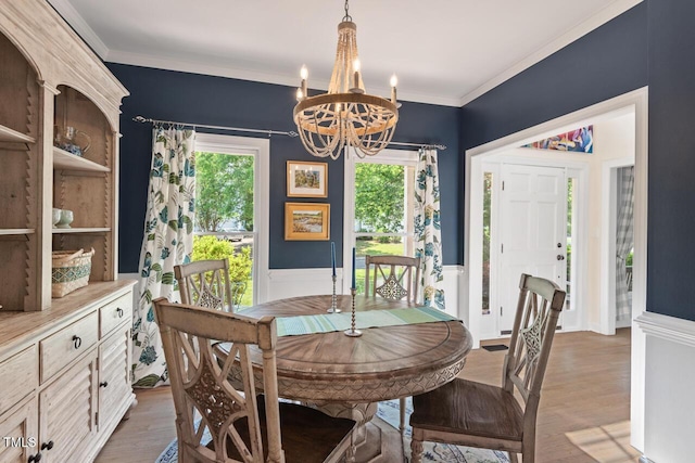 19 Knightsbridge Ct, Durham, NC 27707 - dining space with a chandelier, plenty of natural light, wainscoting, light wood-type flooring, and ornamental molding