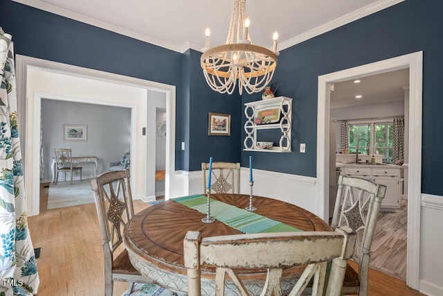 19 Knightsbridge Ct, Durham, NC 27707 - dining space featuring a chandelier, light wood-style flooring, and ornamental molding