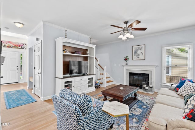 19 Knightsbridge Ct, Durham, NC 27707 - living room featuring wood finished floors, ornamental molding, ceiling fan, stairs, and baseboards