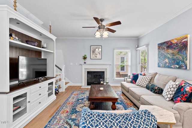 19 Knightsbridge Ct, Durham, NC 27707 - living room featuring a ceiling fan, light wood finished floors, stairway, crown molding, and a fireplace with flush hearth