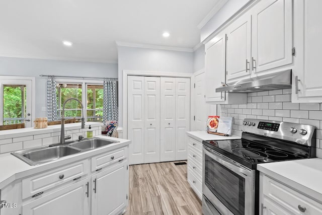 19 Knightsbridge Ct, Durham, NC 27707 - kitchen with stainless steel range with electric stovetop, under cabinet range hood, crown molding, a sink, and white cabinetry
