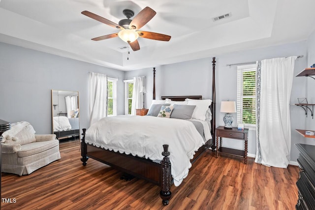 19 Knightsbridge Ct, Durham, NC 27707 - bedroom featuring a tray ceiling, wood finished floors, and a ceiling fan