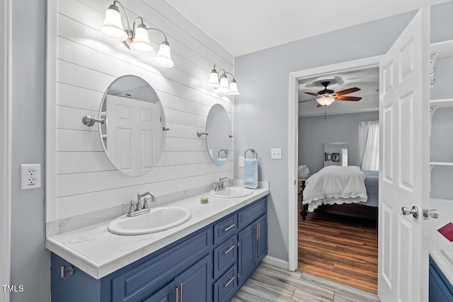 19 Knightsbridge Ct, Durham, NC 27707 - full bathroom with double vanity, ensuite bathroom, a ceiling fan, and wood finished floors