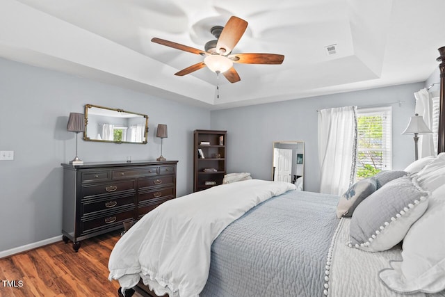 19 Knightsbridge Ct, Durham, NC 27707 - bedroom featuring a raised ceiling, dark wood-style floors, baseboards, and ceiling fan