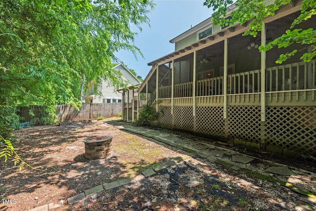 19 Knightsbridge Ct, Durham, NC 27707 - view of yard featuring a sunroom and ceiling fan