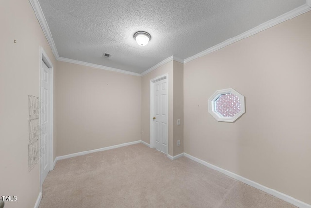 1003 Crimson Dr, Durham, NC 27713 - spare room with a textured ceiling, light carpet, ornamental molding, and baseboards