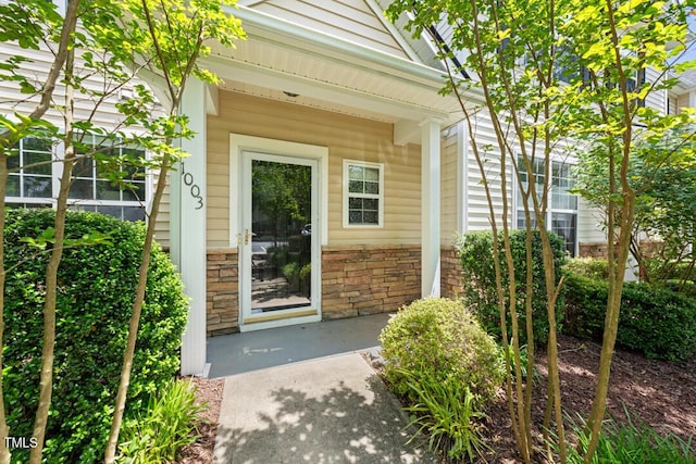 1003 Crimson Dr, Durham, NC 27713 - doorway to property featuring stone siding