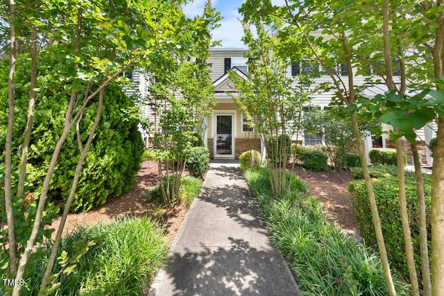 1003 Crimson Dr, Durham, NC 27713 - view of property hidden behind natural elements featuring brick siding