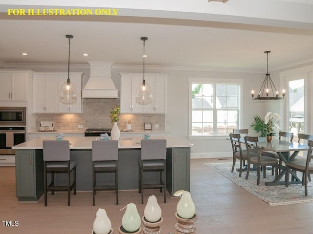 kitchen with stainless steel appliances, custom range hood, light countertops, backsplash, and white cabinets