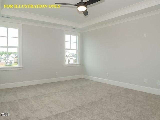 carpeted empty room with a tray ceiling, a ceiling fan, baseboards, and crown molding