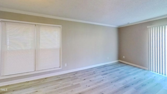 1227 Seaton Rd Unit 60, Durham, NC 27713 - spare room featuring ornamental molding, wood finished floors, and baseboards