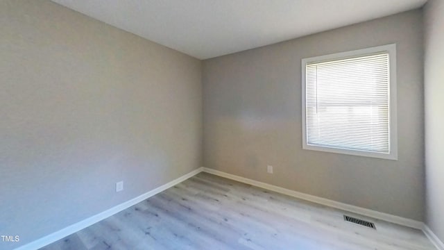 1227 Seaton Rd Unit 60, Durham, NC 27713 - empty room with baseboards and light wood-style flooring