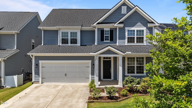 6624 Vestal St, Wake Forest, NC 27587 - view of front facade with an attached garage, roof with shingles, and driveway