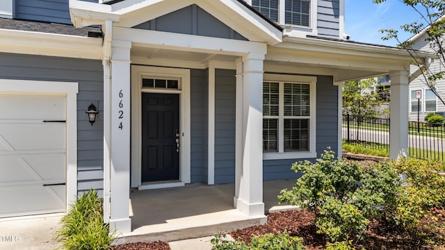 6624 Vestal St, Wake Forest, NC 27587 - view of exterior entry with a porch and a garage