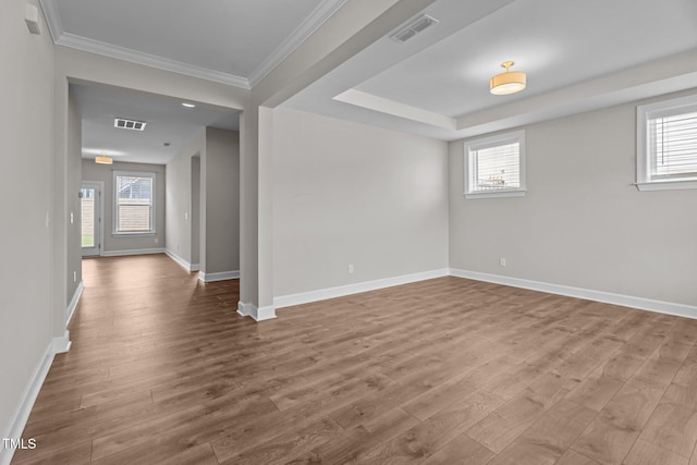 6624 Vestal St, Wake Forest, NC 27587 - spare room featuring wood finished floors, plenty of natural light, and crown molding