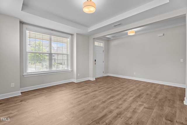 6624 Vestal St, Wake Forest, NC 27587 - foyer featuring a tray ceiling, wood finished floors, and baseboards