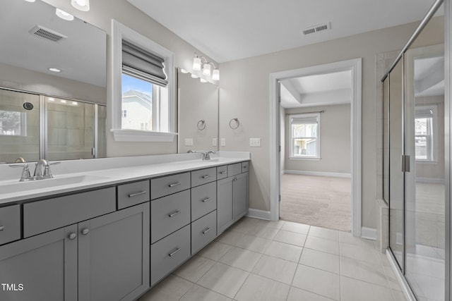 6624 Vestal St, Wake Forest, NC 27587 - full bath with tile patterned flooring, double vanity, a shower stall, and baseboards
