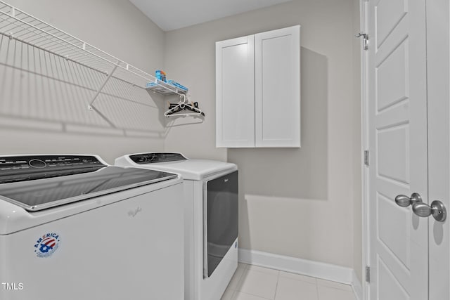 6624 Vestal St, Wake Forest, NC 27587 - washroom featuring cabinet space, washing machine and clothes dryer, baseboards, and light tile patterned flooring