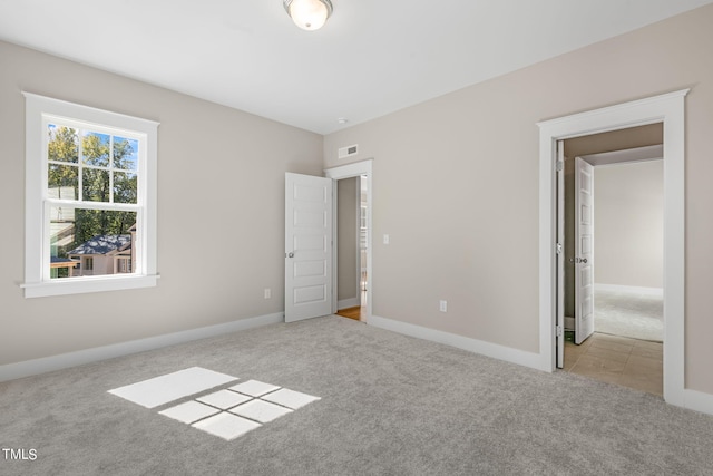 1029 Whitehall Cir, Durham, NC 27713 - unfurnished bedroom featuring carpet flooring and baseboards