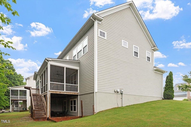 213 Preatonwood Dr, Apex, NC 27539 - view of home's exterior featuring a sunroom, stairway, a lawn, and a ceiling fan
