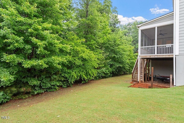 213 Preatonwood Dr, Apex, NC 27539 - view of green lawn featuring a sunroom, stairs, and a ceiling fan