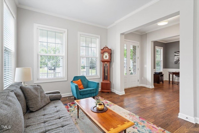 213 Preatonwood Dr, Apex, NC 27539 - living area with wood finished floors, crown molding, and baseboards