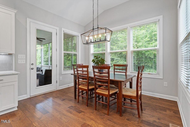 213 Preatonwood Dr, Apex, NC 27539 - dining area with vaulted ceiling, dark wood-style floors, plenty of natural light, and a chandelier