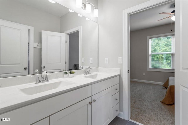 213 Preatonwood Dr, Apex, NC 27539 - full bathroom with double vanity, a ceiling fan, and baseboards