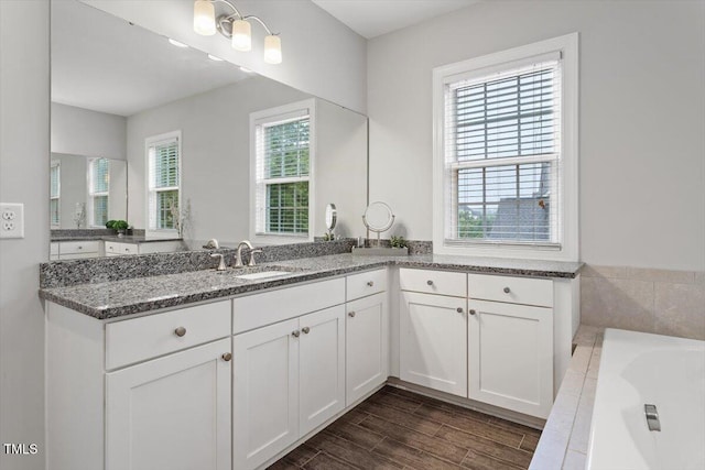 213 Preatonwood Dr, Apex, NC 27539 - full bath with a bath, vanity, and wood finished floors