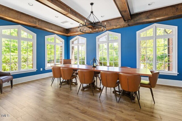 213 Preatonwood Dr, Apex, NC 27539 - dining area featuring a chandelier, baseboards, beamed ceiling, and wood finished floors
