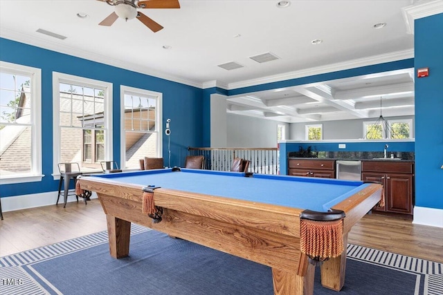 213 Preatonwood Dr, Apex, NC 27539 - game room with pool table, bar with sink, wood finished floors, crown molding, and beamed ceiling