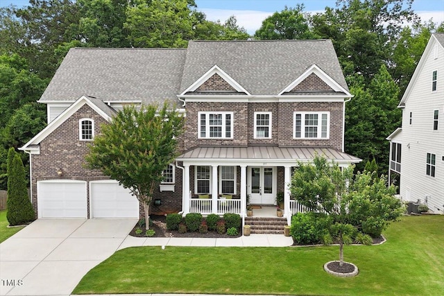 213 Preatonwood Dr, Apex, NC 27539 - shingle-style home with brick siding, concrete driveway, a porch, an attached garage, and a front lawn