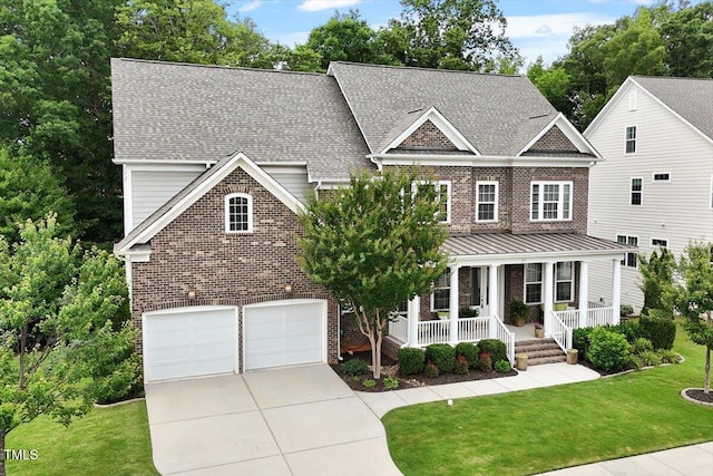 213 Preatonwood Dr, Apex, NC 27539 - view of front of house with brick siding, covered porch, concrete driveway, an attached garage, and a front lawn