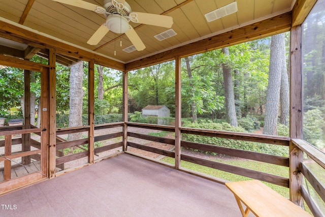 205 W Oak Ave, Wake Forest, NC 27587 - unfurnished sunroom with a ceiling fan and a wooded view