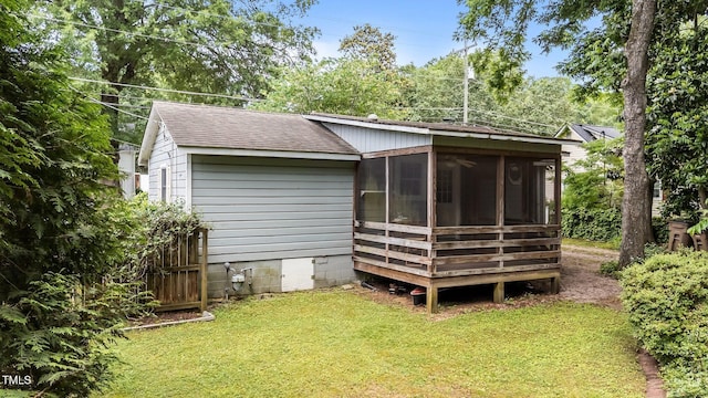 205 W Oak Ave, Wake Forest, NC 27587 - rear view of property featuring a shingled roof, a sunroom, a yard, and crawl space