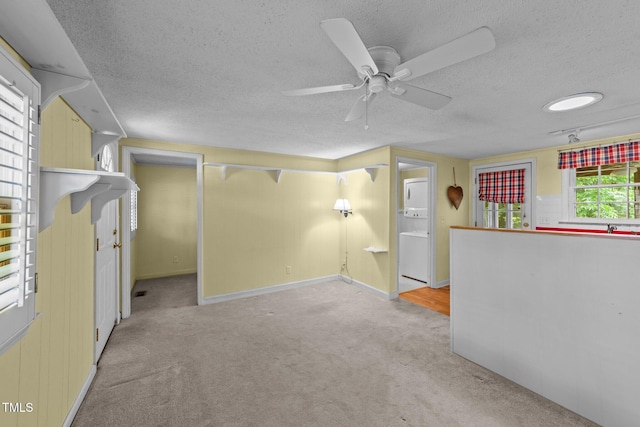 205 W Oak Ave, Wake Forest, NC 27587 - carpeted empty room featuring a textured ceiling, a ceiling fan, washer / clothes dryer, and baseboards