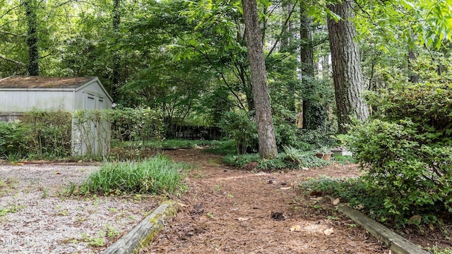 205 W Oak Ave, Wake Forest, NC 27587 - view of yard featuring a view of trees