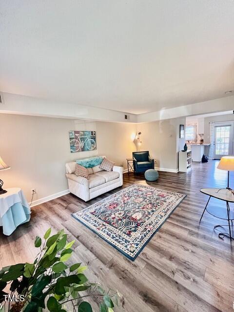 141 Jones Franklin Rd Unit G, Raleigh, NC 27606 - living area with wood finished floors and baseboards