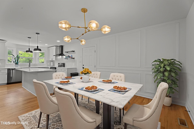 4259 Old Faison Rd, Knightdale, NC 27545 - dining room featuring a chandelier, light wood-style flooring, and recessed lighting