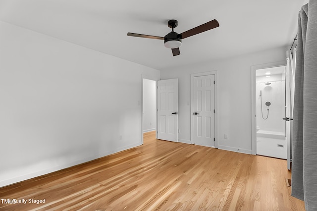 4259 Old Faison Rd, Knightdale, NC 27545 - unfurnished bedroom featuring light wood-style flooring, baseboards, ensuite bathroom, and a ceiling fan