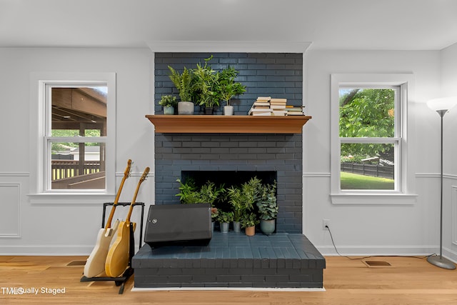4259 Old Faison Rd, Knightdale, NC 27545 - detailed view of wood finished floors, baseboards, and a fireplace