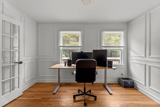 4259 Old Faison Rd, Knightdale, NC 27545 - office space with a decorative wall and light wood finished floors