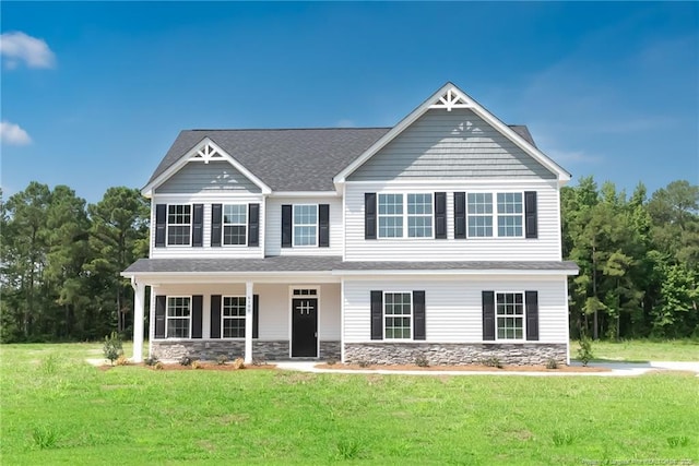 00 John B Carter Rd, Fayetteville, NC 28312 - view of front of house featuring stone siding, a front yard, a shingled roof, and covered porch